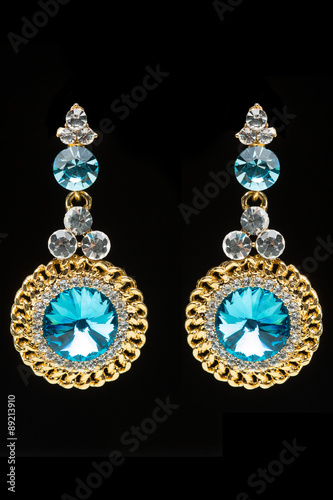 earrings with blue stones on the black 