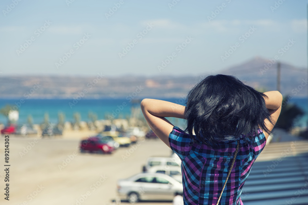 girl looks at the sea