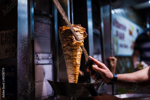 cutting doner meat in a street restaurant in istanbul photo