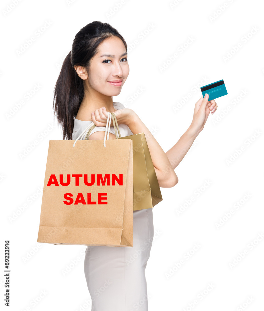 Happy shopping woman credit card and shopping bag for showing au Happy shopping woman credit card and shopping bag for showing au