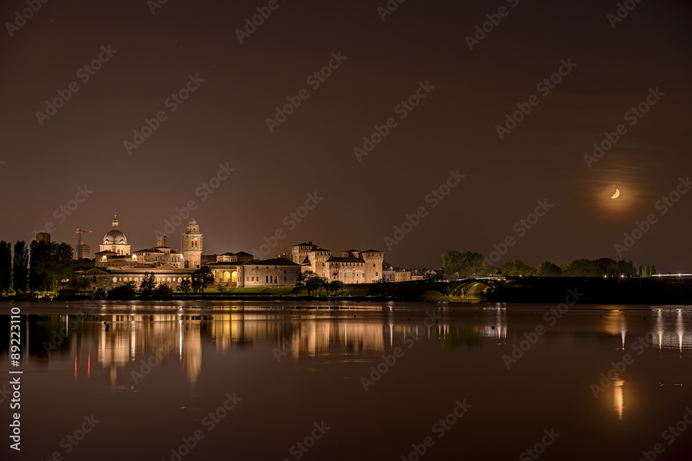 Mantua night skyline reflection river