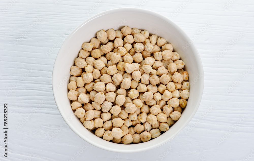 chickpeas isolated on wooden background.