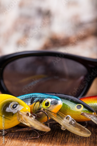 closeup fishing baits wobblers with sunglass