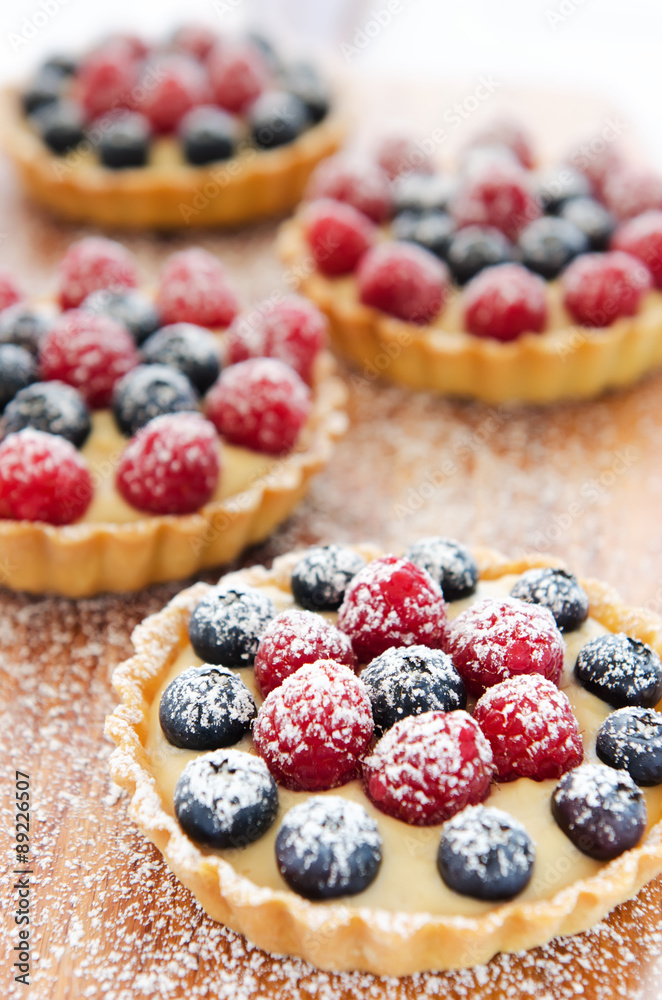 Icing sprinkles on tarts Icing sprinkles on tarts