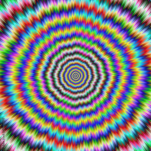 Brain Teaser / A colorful psychedelic fractal image with an optically challenging circular design in yellow blue red and turquoise.