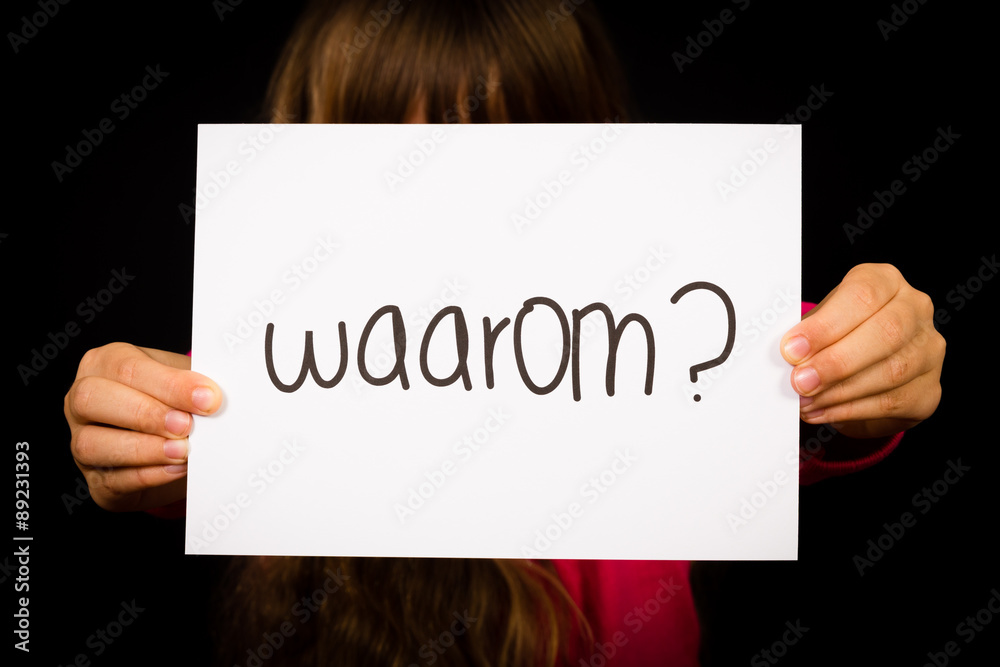 Child holding sign with Dutch word Waarum - Why Child holding sign with Dutch word Waarum - Why