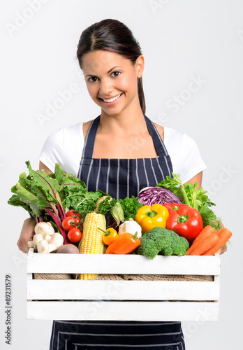 Smiling chef with fresh local organic produce