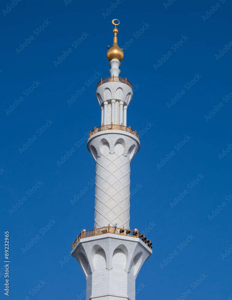  minarets against blue sky. Mosque in UAE