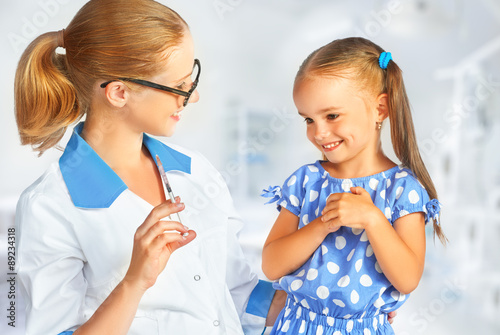 Doctor a pediatrician makes child vaccinated