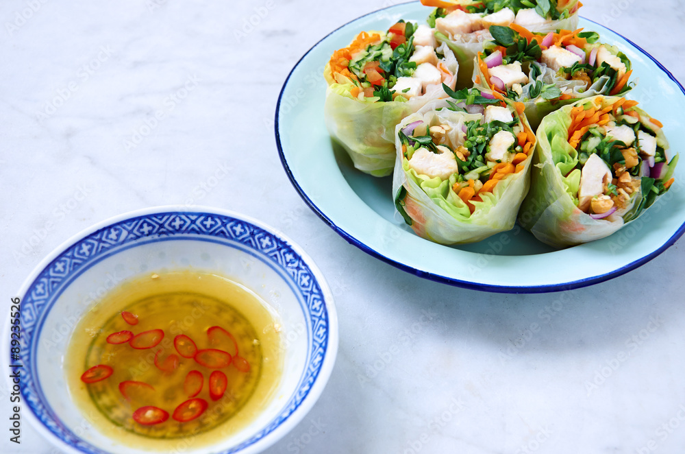 Serving healthy fresh asian spring roll wraps Serving healthy fresh asian spring roll wraps
