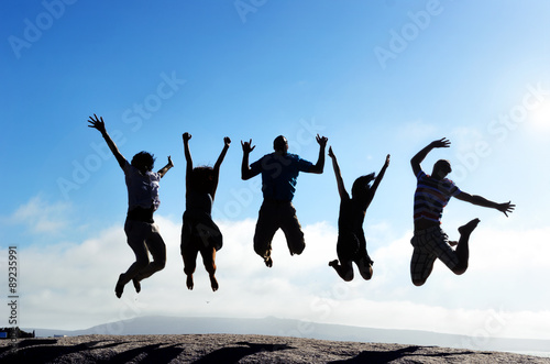 Jumping silhouettes photo
