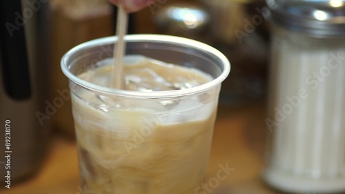 Video of ice coffee served with cream and then stirred
