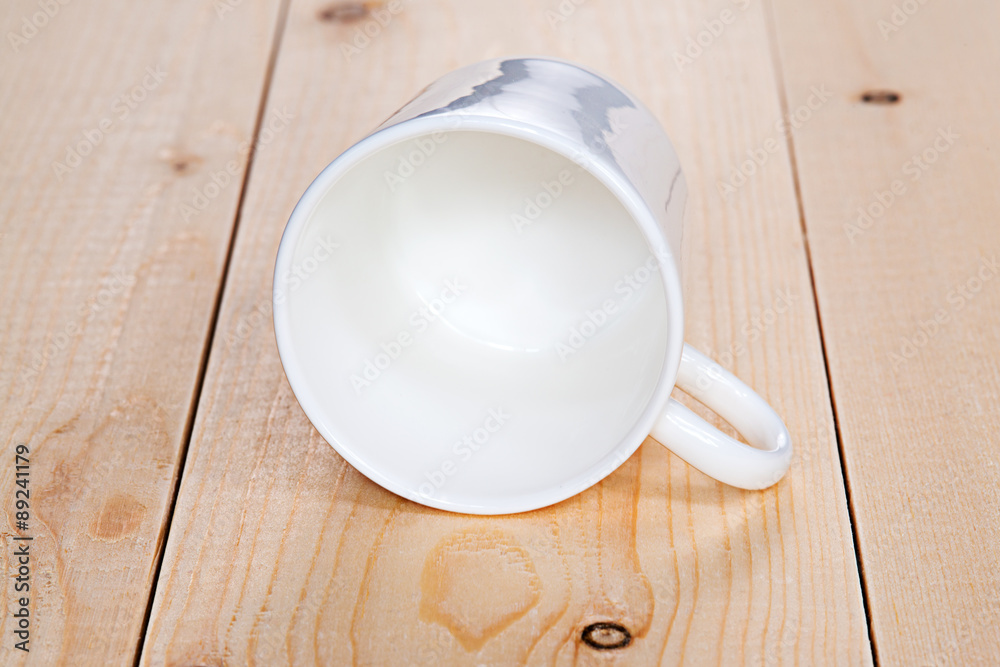 Pure white cup is on the board Pure white cup is on the board