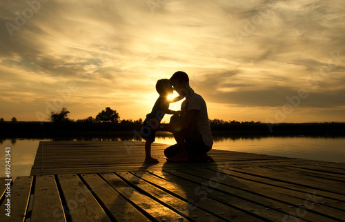 Family sunset on the lake