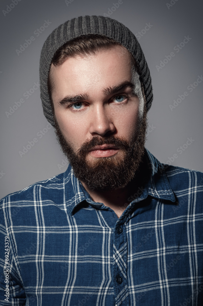 Obraz premium Handsome bearded man in checkered shirt