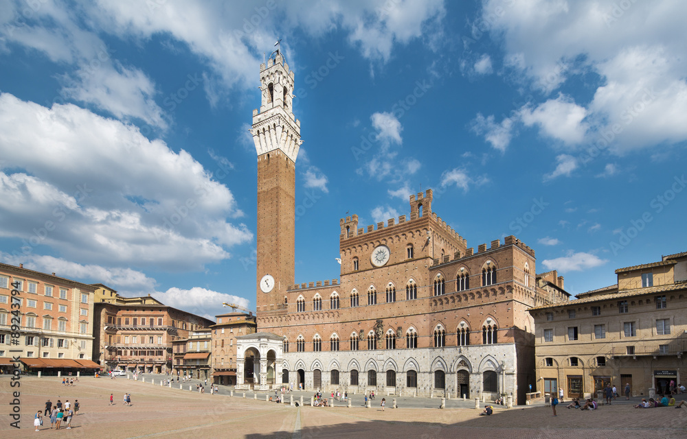 SIENA, ITALY - June 13, 2015: tourists enjoy Piazza del Campo square in Siena, Italy.