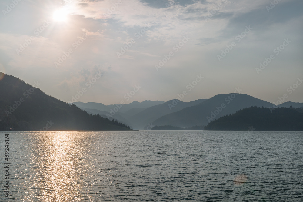 Clear mountain lake and rocky mountains in late summer. Clear mountain lake and rocky mountains in late summer.