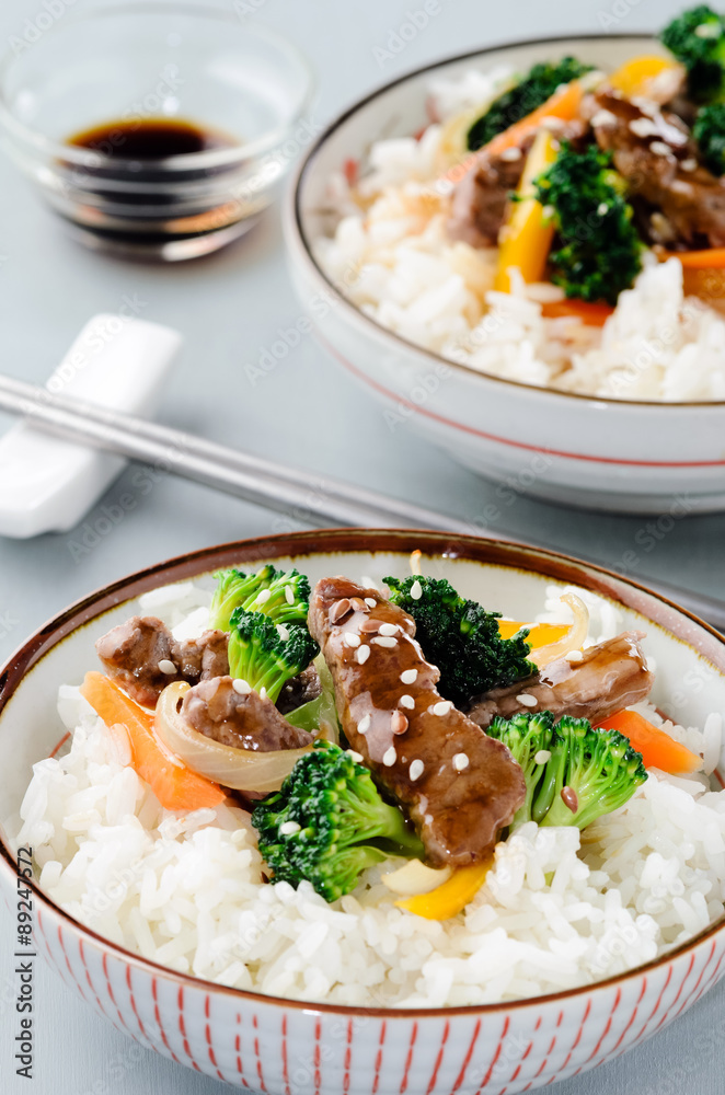 Stir-fried beef strips on white rice Stock Photo | Adobe Stock