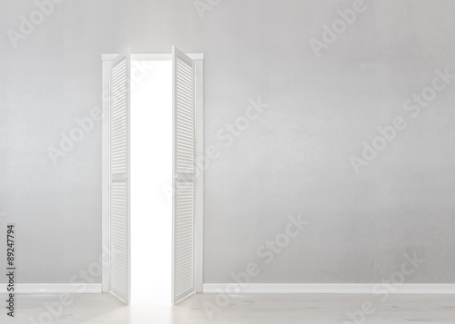 Open White Door on grey Wall