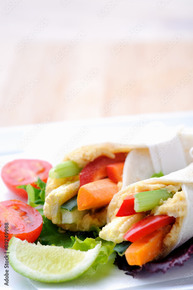 Healthy bite size wraps with side salad and lots of copyspace Healthy bite size wraps with side salad and lots of copyspace