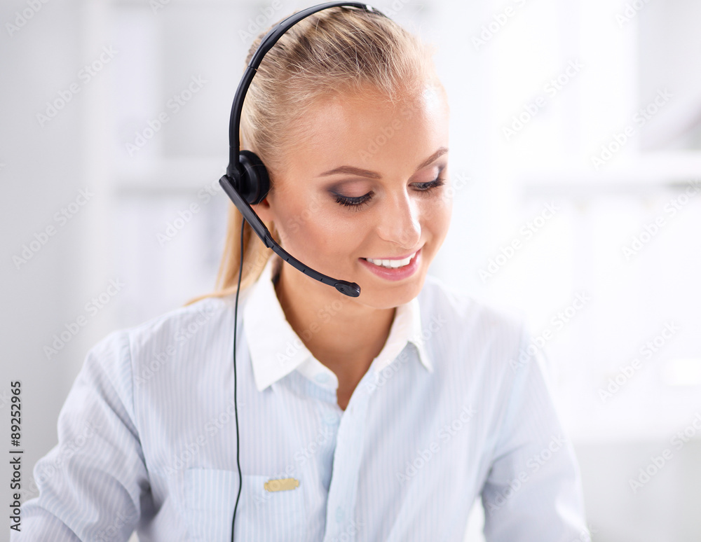 Close-up portrait of a customer service agent sitting at office Close-up portrait of a customer service agent sitting at office