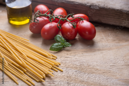 Ingredients for a typical italian lunch lying on a wooden table