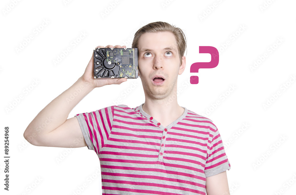 © phoenix021 - Memory loss concept, young man holding hard drive next to his head