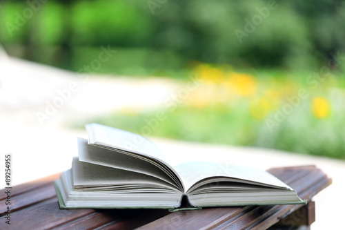 Stack of books outdoors, on blurred background © Africa Studio