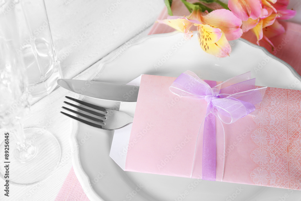 Table setting with spring flowers, close-up Table setting with spring flowers, close-up