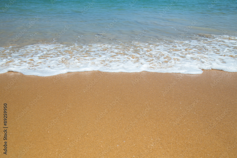 Wave of the sea on the sand beach