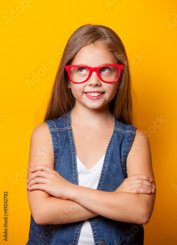 Beautiful young girl with red glasses