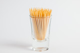 Toothpick in the glass on white paper background