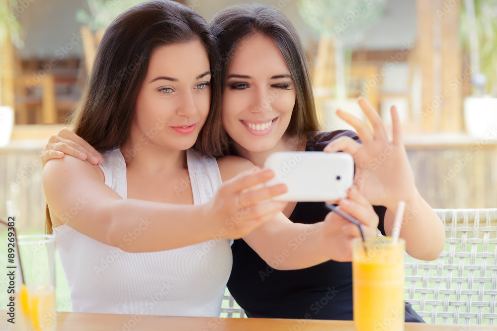 Happy Girls Taking a Selfie Together Happy Girls Taking a Selfie Together