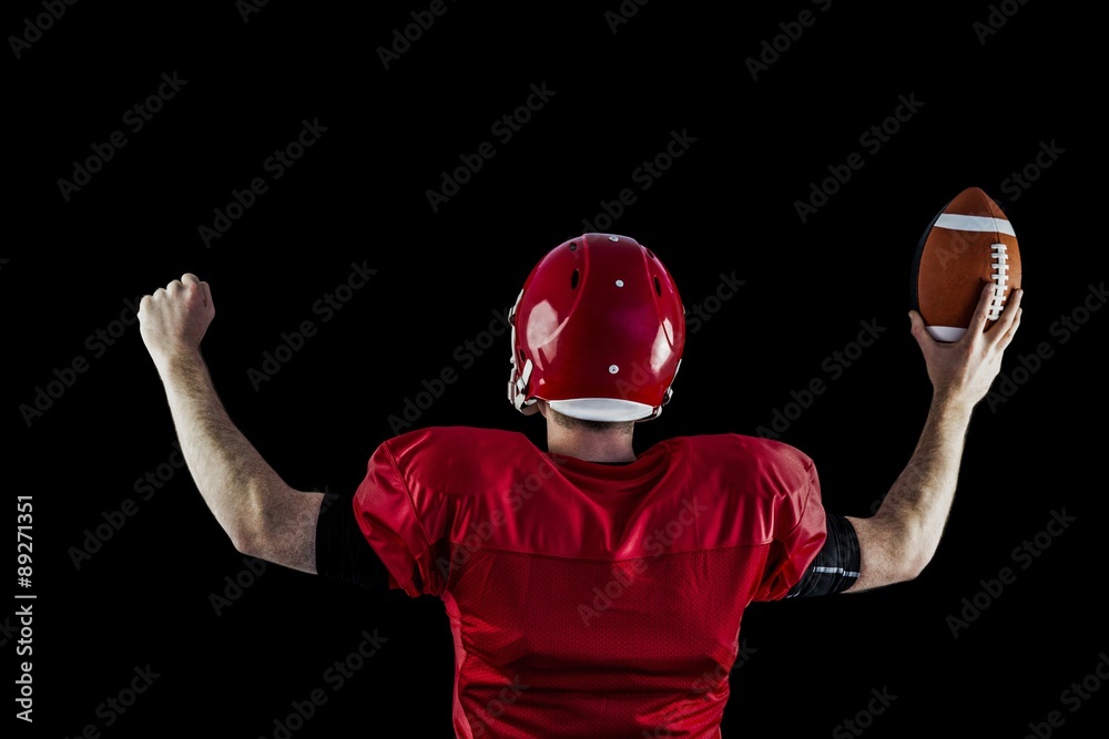 Rear view of american football player triumphing Rear view of american football player triumphing