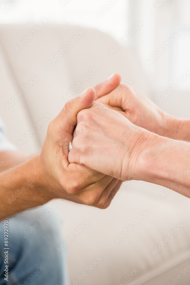 Close up view of therapist comforting male patient