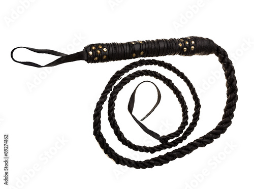 black leather whip isolated on white background  photo