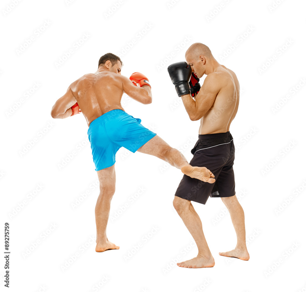 Kickboxers sparring on white Kickboxers sparring on white