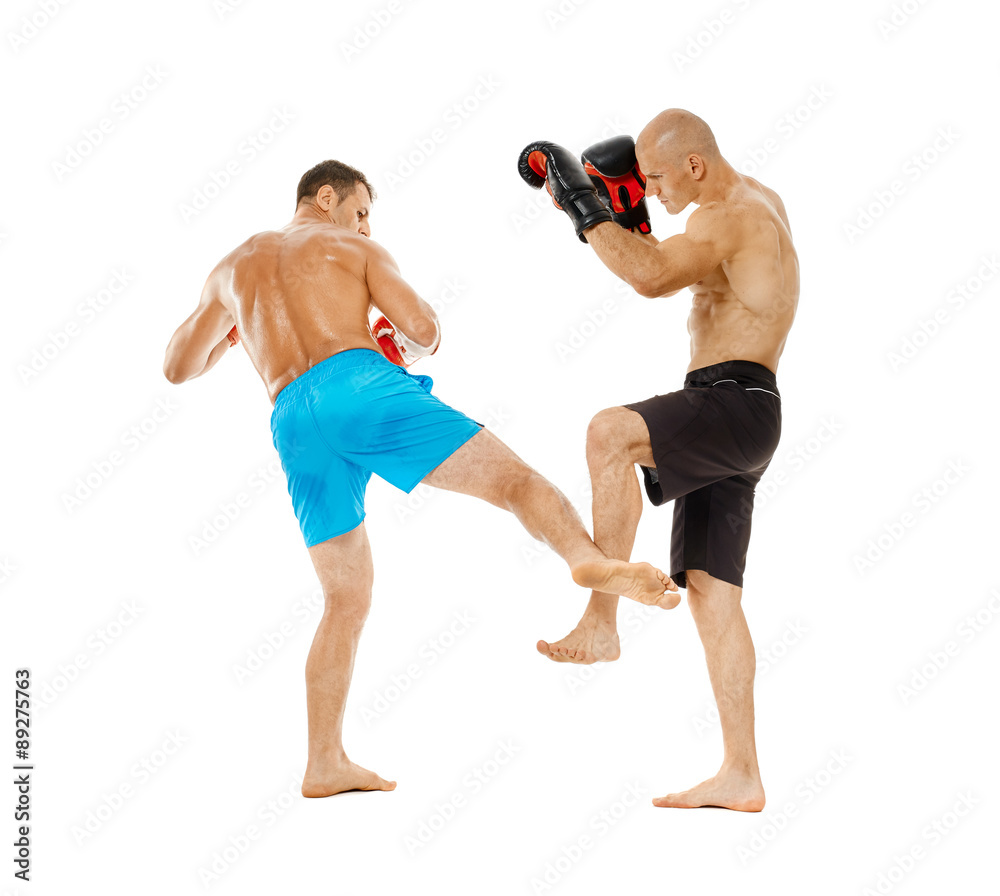 Kickboxers sparring on white Kickboxers sparring on white