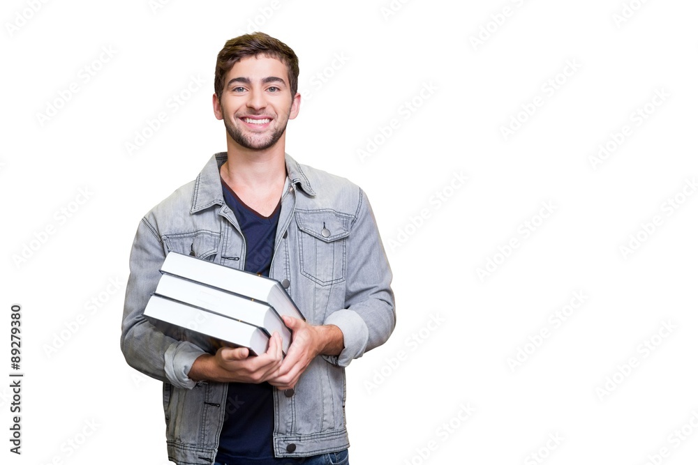 Composite image of student smiling at camera in library Composite image of student smiling at camera in library