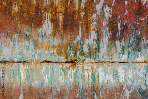 surface of rusty iron with remnants of old paint texture background