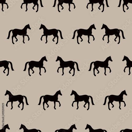 Vector seamless pattern with black horses silhouettes