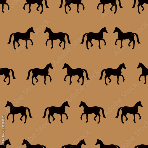 Vector seamless pattern with black horses silhouettes