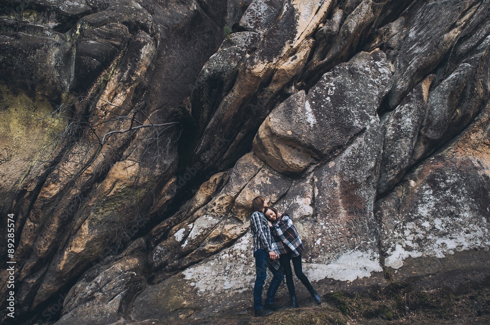 Fototapeta premium couple in love, walk on the rocks Dovbush Carpathian Mountains
