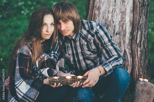 couple in love, outdoors near old tree