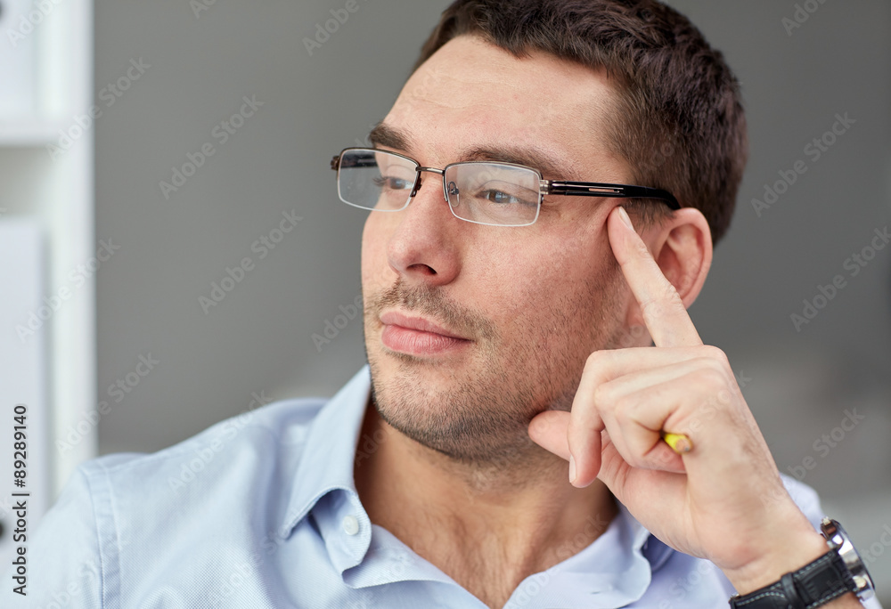 portrait of businessman in eyeglasses at office portrait of businessman in eyeglasses at office