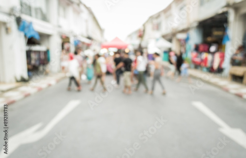 Blurred people walking on the street