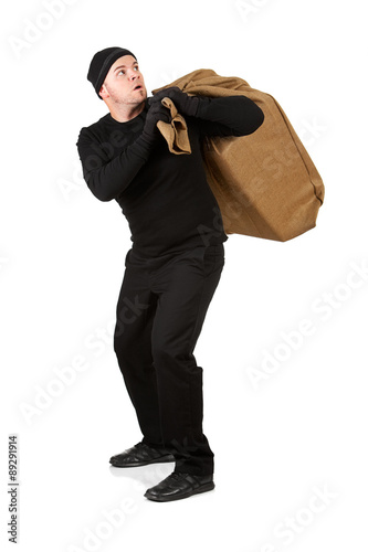 Canvas Print Burglar: Thief Tries to Get Away with Burlap Sack