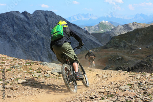 Downhillbiker im Gebirge photo