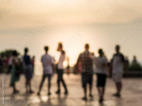 Blurred group of people during sunset