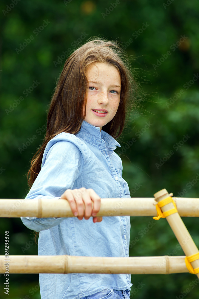 Obraz premium Moving into adulthood. Outdoor portrait of teenage girl.